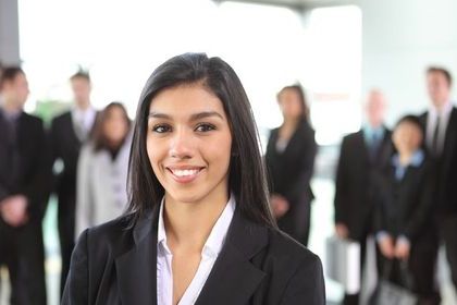 Image of girl with dark hair and smile.